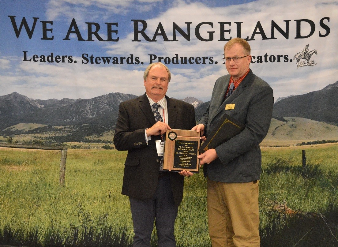 Dr. Steven R. Archer received the 2019 W. R. Chapline Research Award Dr. Steven Archer receiving the 2019 W. R. Chapline research Award from Society for Range Management President Dr. Barry Irving.